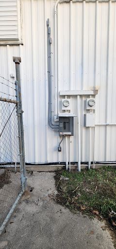 Electrical panel and service equipment installed on a building.